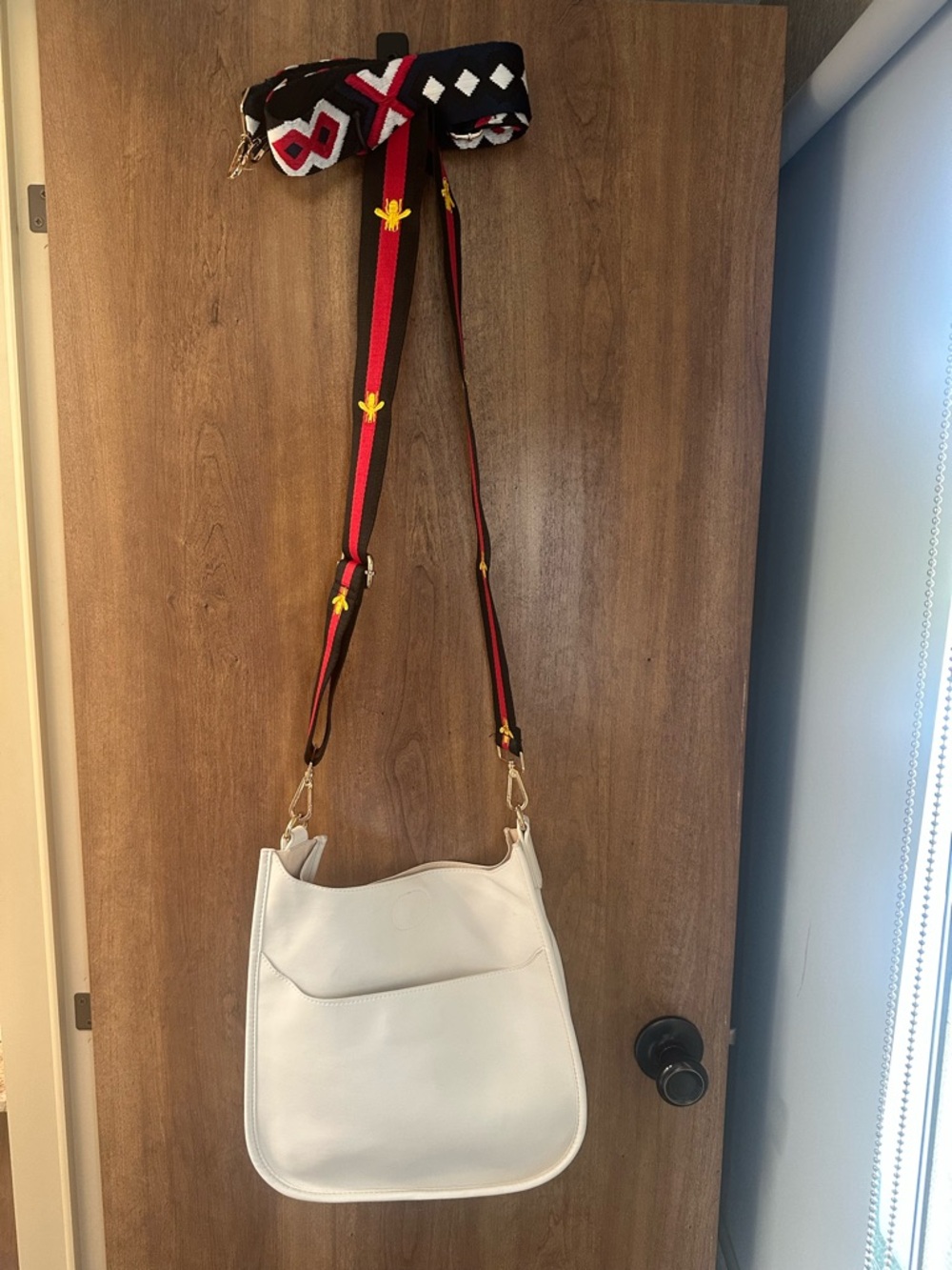 Ah dorned white crossbody with 2 Removable straps. Black red bee/ multi Like new